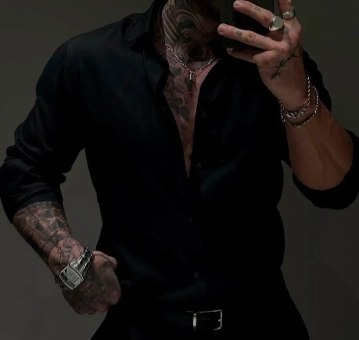 Confident AI boyfriend character in a black shirt with a bold, dominant personality