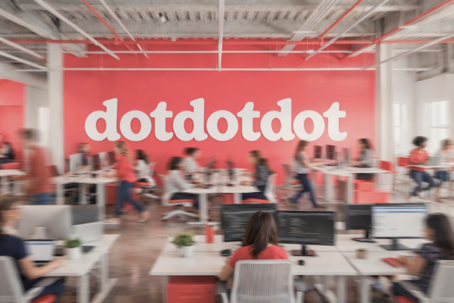 Company office workers with company logo "dotdotdot" in the background.